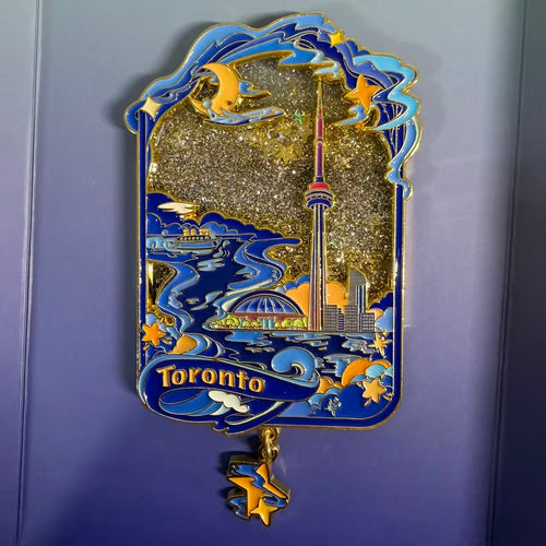 Toronto skyline liquid sand fridge magnet - glowing night cityscape in swirling sand