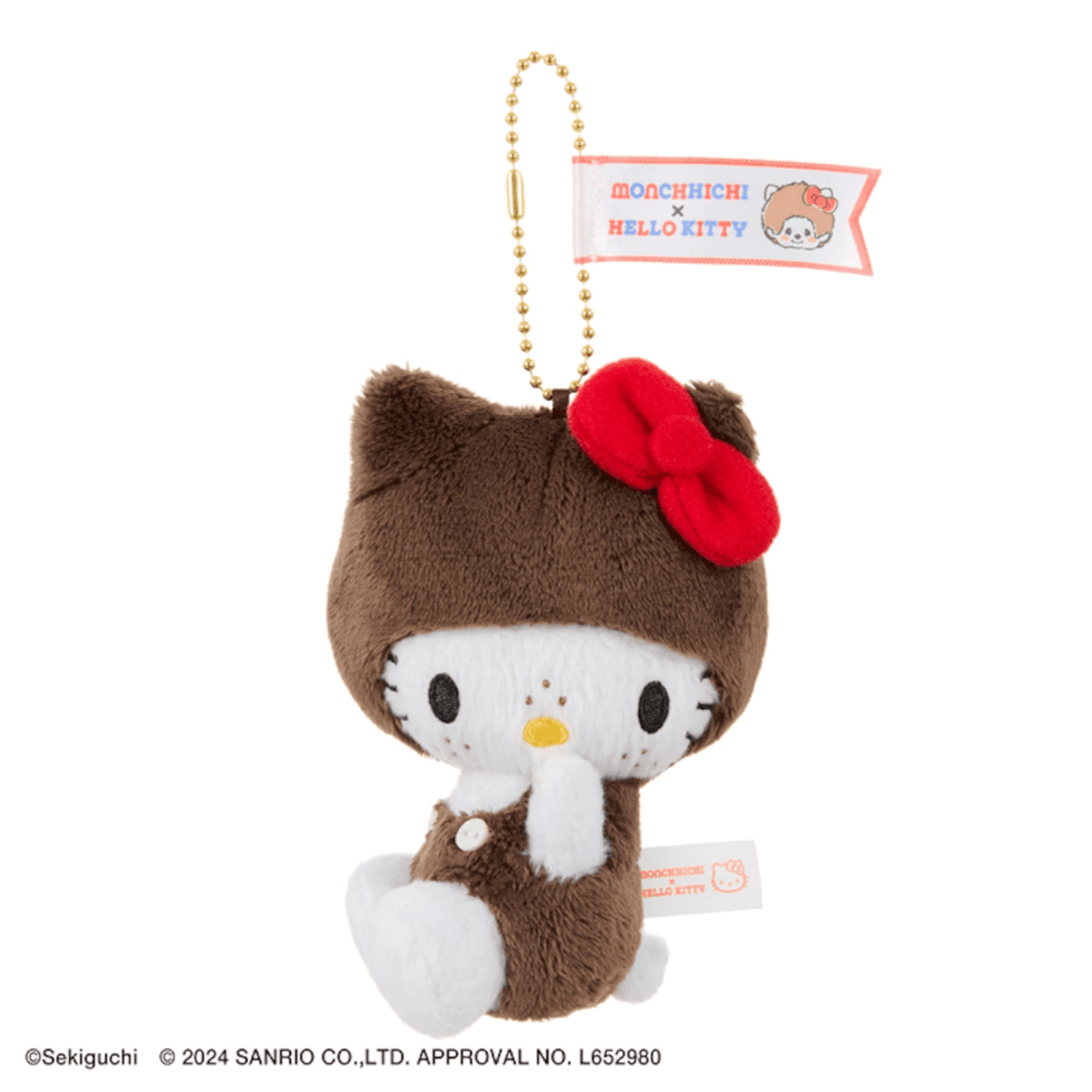 Hello Kitty plush mascot in a brown Monchhichi costume with a red bow and anniversary tag