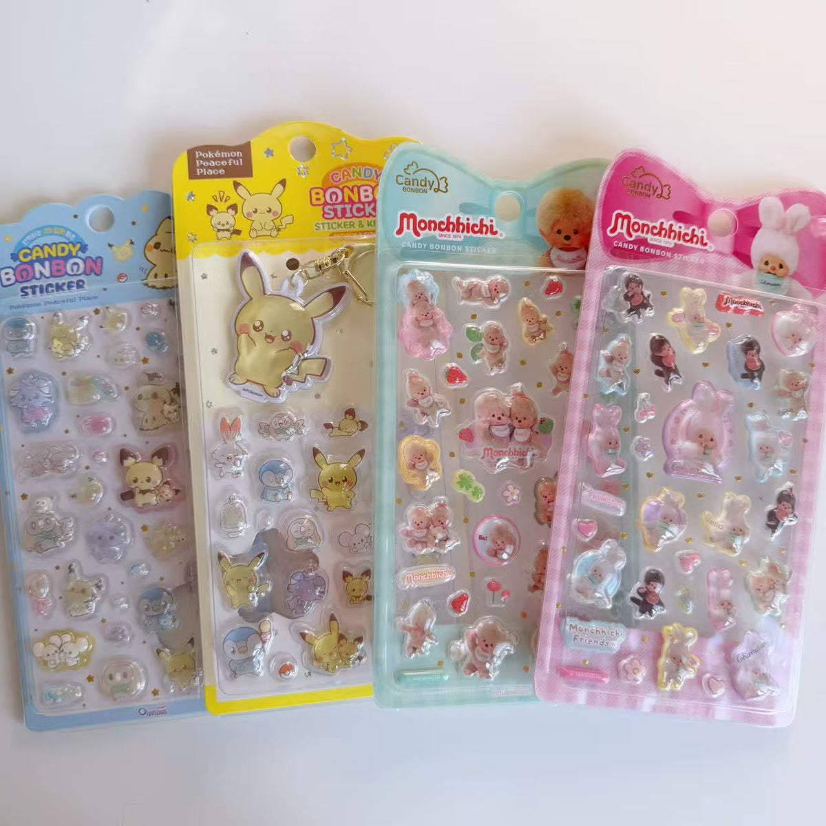 Candy BONBON Pokémon sticker sheet, Pikachu sticker and keyring set, and two Monchhichi sticker designs displayed together.
