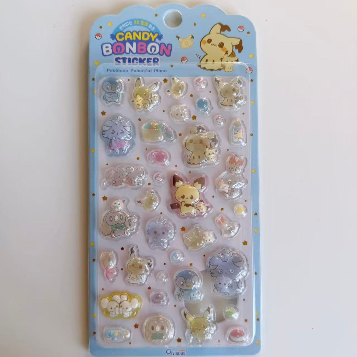 Pokémon Peaceful Place Candy BONBON 3D sticker sheet in blue packaging with Mimikyu, Pikachu, Pichu and other Pokémon.