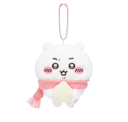 Chiikawa plush bag charm wearing a pink scarf and holding a white steamed bun, with a pink ball chain.