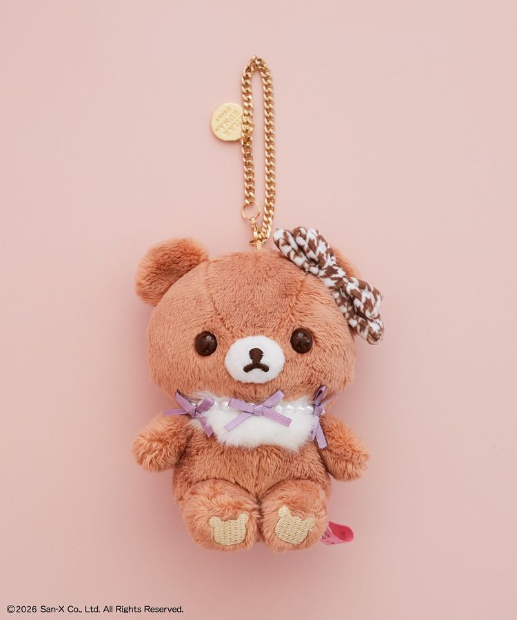 Chairoikoguma x Maison de FLEUR plush bag charm with a brown houndstooth head bow, lavender ribbons, white chest tuft and gold-coloured chain.