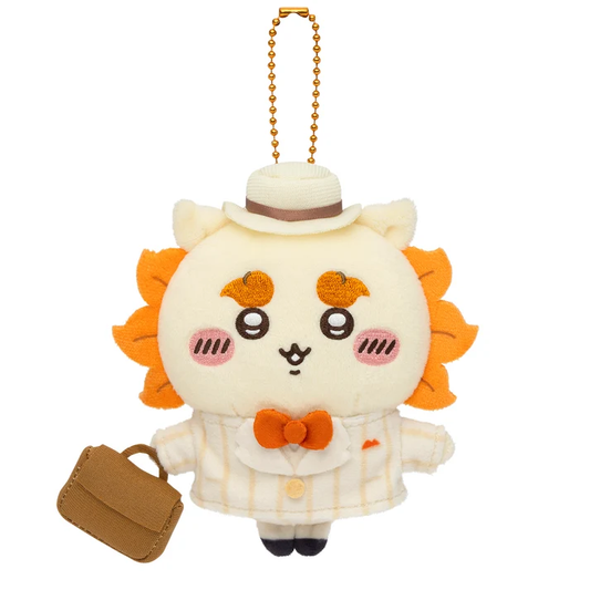 Chiikawa Shisa Otaru Retro plush bag charm in a cream striped suit, orange bow tie and hat, carrying a brown bag beneath a gold-coloured ball chain.